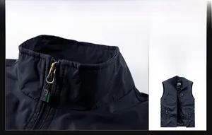 Detail of the stand collar and metal sports zipper on this navy blue outdoor vest
