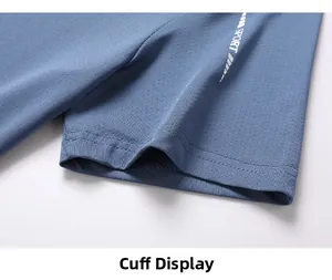 Detail of blue-grey quick-dry mesh fabric with SPORT logo and double-stitched cuff