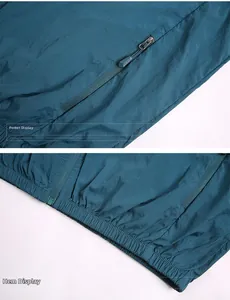 Détails de la poche zippée et de l'ourlet élastique d'une veste de protection solaire légère