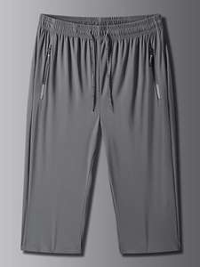 Detail of grey quick-dry sports shorts showing elastic waistband and KE SPORTS drawstring