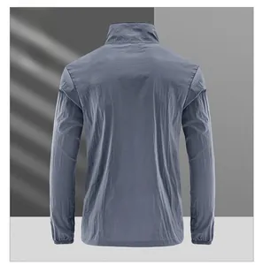 Detail view of the back of a gray-blue sun protection jacket with elastic cuffs