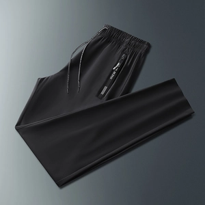 Detailed view of elastic waistband with ke sports drawstring and side zipper pocket