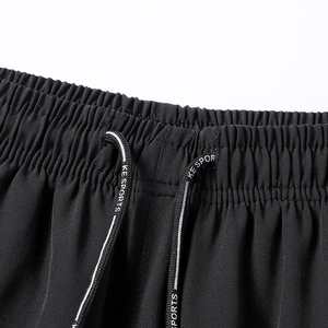Detail of elastic waist with KE SPORTS drawstring on thin ice silk sports trousers