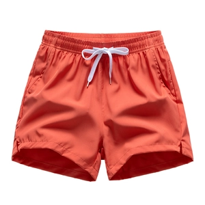 Coral quick-dry sports shorts with elastic drawstring waist and side slits for running