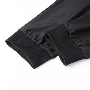 Detail view of elastic ribbed cuffs on breathable black summer ice silk trousers