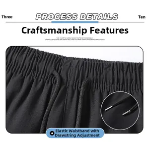 Detail view of elastic waistband with round drawstring and silver metal tips on pants