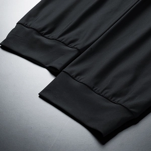 Detail of high-elasticity quick-dry ice silk sport pants showing rib knit cuffs and stitching