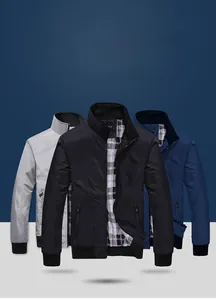 Detail view of utility jackets showing zip pockets, ribbed cuffs and plaid lining