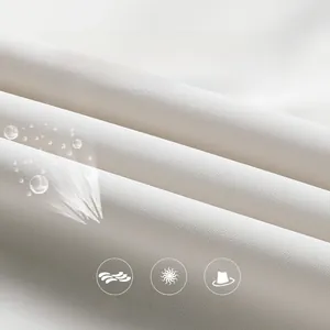 Close-up of breathable and anti-pilling white outdoor jacket fabric with fine texture