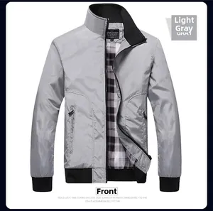 Front view of light gray men's stand collar jacket with ribbed cuffs and black-white lining