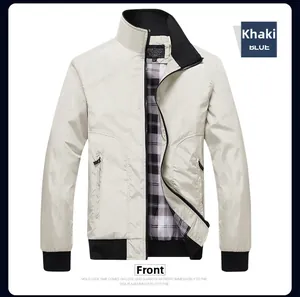 Detail of khaki bomber jacket featuring black ribbed collar and plaid inner lining