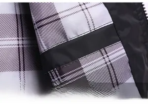 Detail of the black, white and purple checkered lining inside this casual work jacket