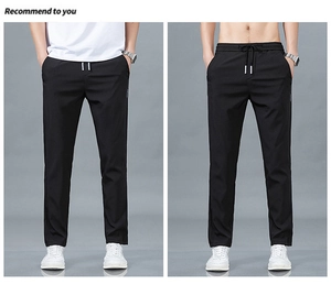 Détail du pantalon en soie glacée noire pour homme avec taille élastique et poches latérales