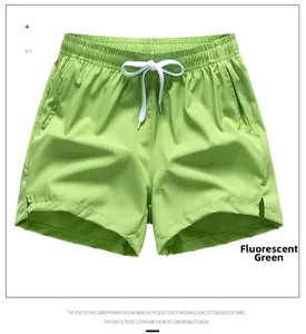 Detail view of neon green breathable shorts with adjustable drawstring and side split design
