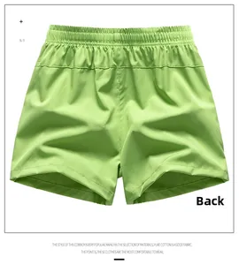 Rear view of light green casual shorts featuring elastic waistband and lightweight fabric