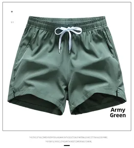 Detail view of army green casual shorts featuring elastic drawstring waist and side slit