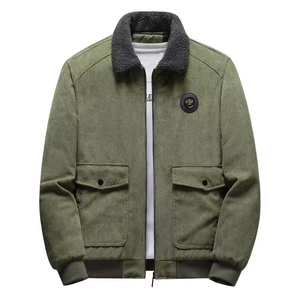 Detail of army green corduroy jacket with faux shearling collar and utility pockets