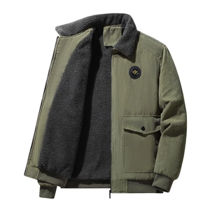Close-up of military green corduroy jacket with thick grey fleece lining and chest patch