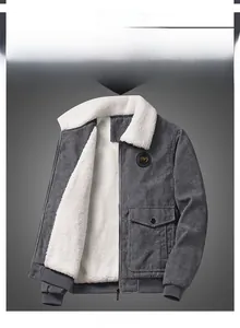Detail of grey corduroy jacket with white fleece lining and elastic ribbed cuffs