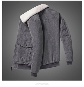 Detail of grey corduroy jacket featuring white faux fur collar and ribbed cuffs