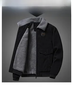 Detailed view of black corduroy jacket with grey fleece lining and TOP badge