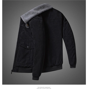 Detailed close-up of corduroy jacket texture with soft grey faux fur collar and zipper