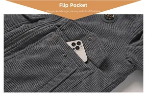 Detailed close-up of dark grey corduroy jacket with large flap pocket and metal zipper