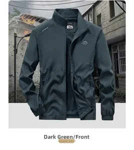 Detailed front view of a dark green outdoor jacket featuring a standing collar and embroidery