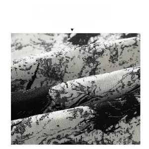 Macro shot of high-density textured black and white ink-splash pattern fabric