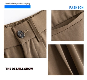 Detail of elastic waist with resin button and high-density twill fabric on brown trousers