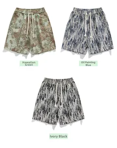 Detail of three men's summer shorts showing elastic drawstrings and textured patterns