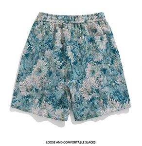 Detail of floral jacquard texture, elastic waist and back pocket on summer shorts