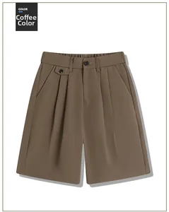 Detail of coffee brown casual shorts showing waist button design and pleated texture