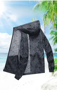 Close-up of lightweight ice silk sun protection jacket with tropical palm leaf texture