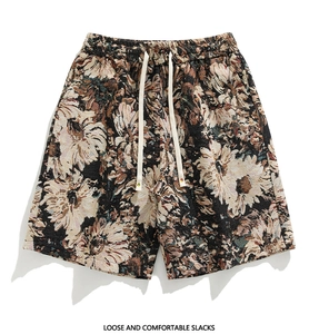 Detailed view of heavy jacquard fabric texture and adjustable drawstring on floral shorts