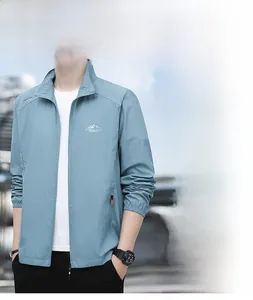 Close-up of light blue sun protection jacket with stand collar and outdoor logo detail
