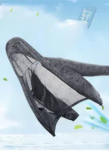 Detail of lightweight dark gray sun protection jacket featuring a leaf print and hood