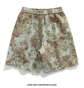 Detail of floral jacquard fabric texture on loose casual shorts with elastic waistband
