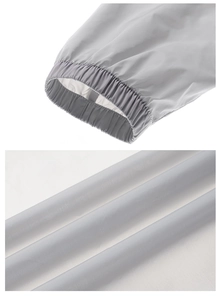 Détail de la veste de protection solaire grise avec poignets élastiques et tissu fin