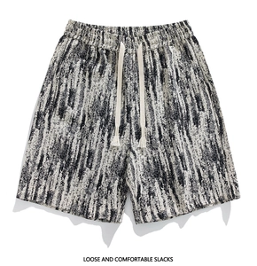 Detail of loose casual shorts with black and white abstract ink texture and drawstring waist