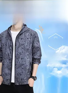 Detail of gray sun protection jacket with black leaf print and elastic cuffs for outdoor wear