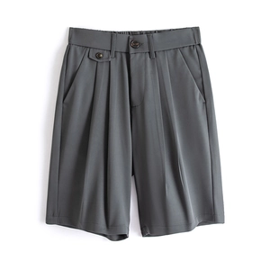Dark grey wide-leg pleated shorts with smooth drape and elastic waistband