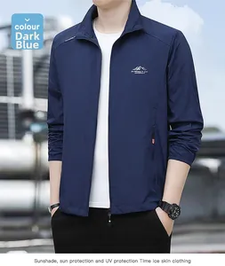 Detail of dark blue sun protection jacket with outdoor logo and UV resistant fabric