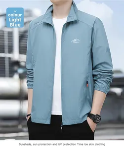 Detail of light blue sun protection jacket with outdoor logo and UV resistant tech fabric