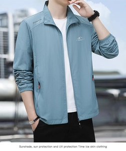 Detail of light blue sun protection jacket showing zipper and elastic cuff on model