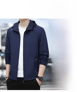 Detail of navy blue hooded sun protection jacket with elastic cuffs and thin tech fabric
