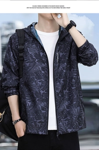 Detail of hooded sun protection jacket with tropical leaf print on lightweight fabric