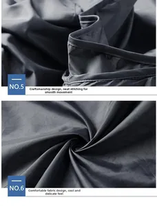 Detailed stitching on dark grey sun protection jacket with cool-to-touch fabric texture