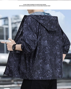 Detail of men's hooded sun protection jacket with dark purple palm leaf patterns