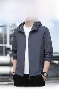 Detail of a dark grey men's lightweight UV protection jacket with a hood for outdoor